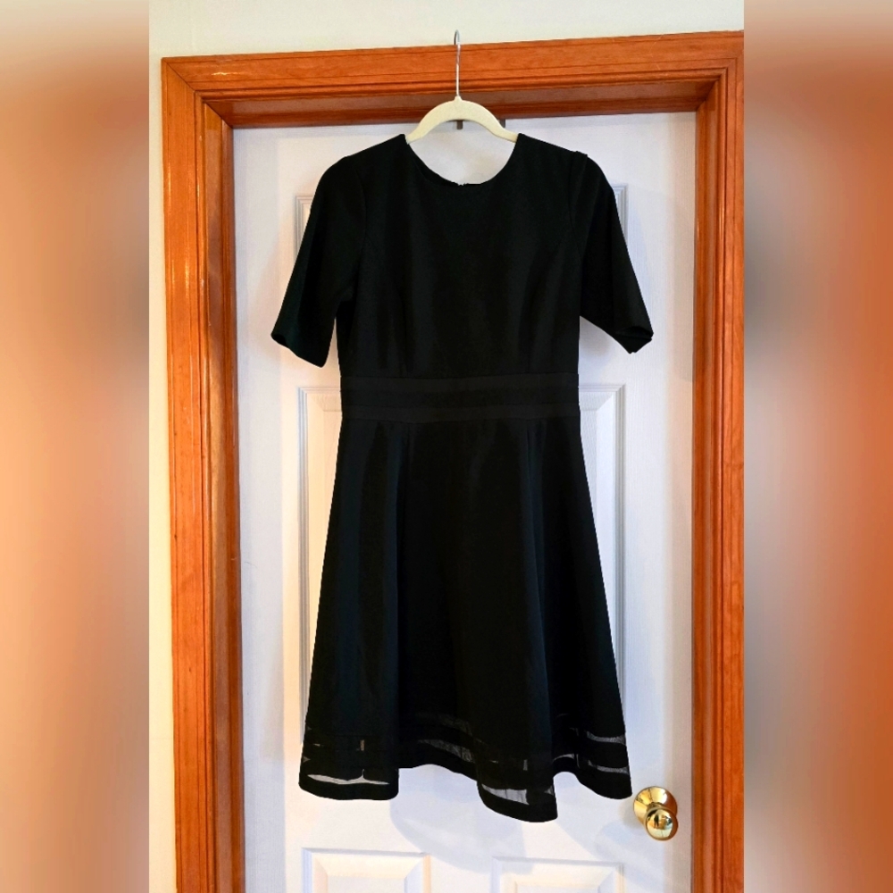 Calvin Klein size 10 classy black dress with mess skirting
